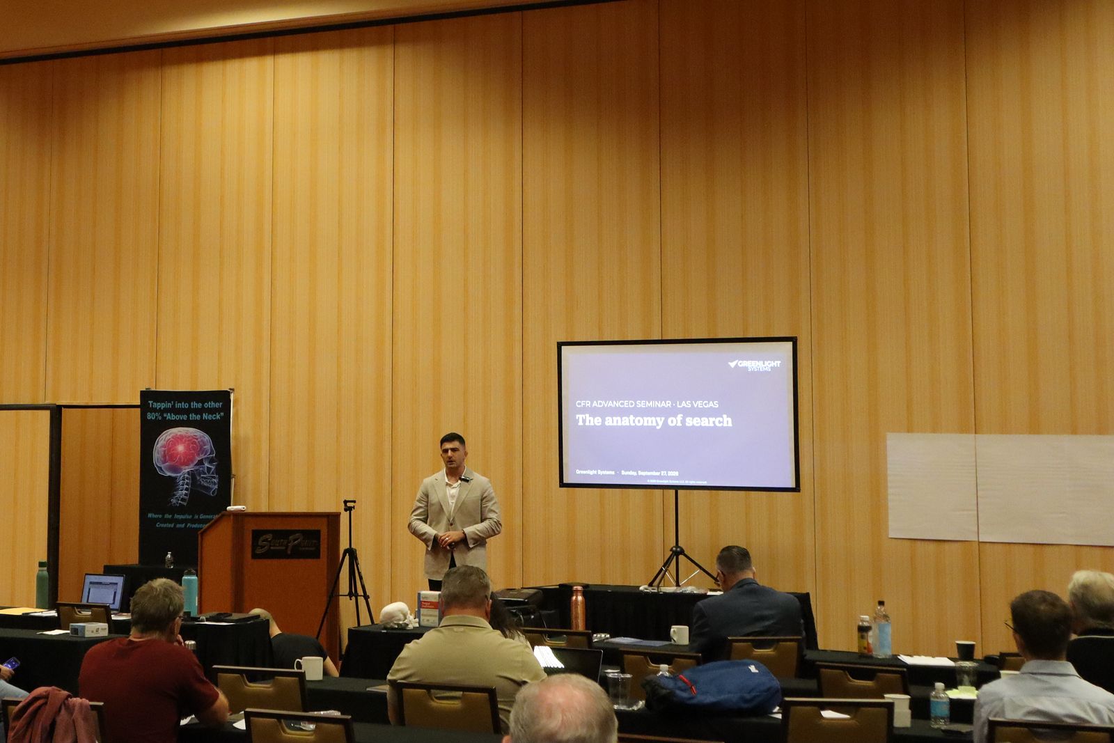 The seminar room at South Point, Las Vegas, with Jonathan Tomasian on stage beside a title slide reading CFR Advanced Seminar, The anatomy of search